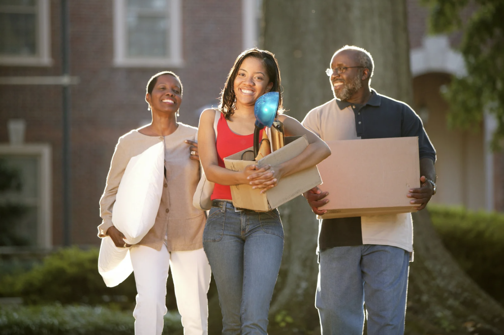Parents helping their student move onto college campus with car shipping service.