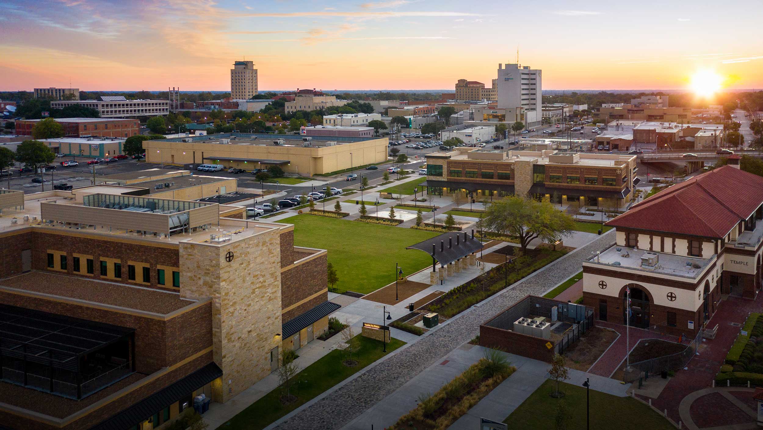 Image of Killeen Texas economic center during sunset with business buildings.