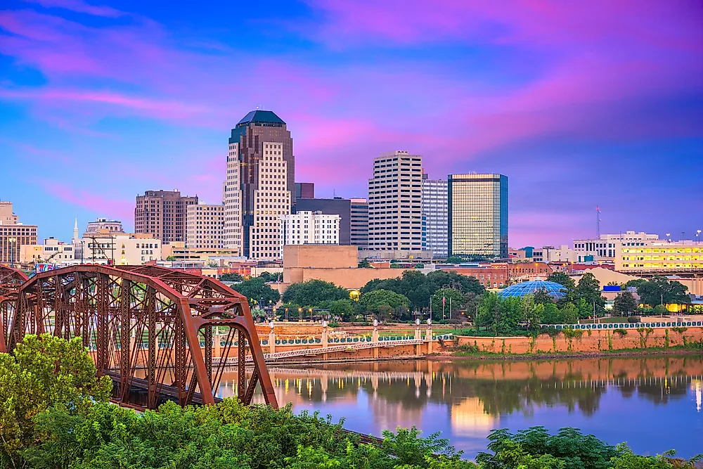 View of the Louisiana skyline with city buildings at sunset.
